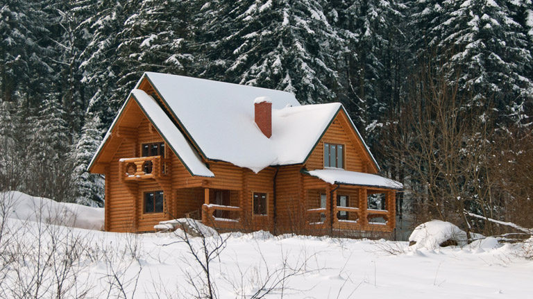 snowy log cabin
