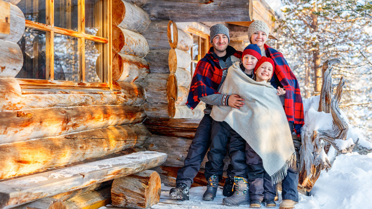 family at their snowy vacation home
